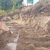 Construction of the retaining wall on Dame Dorothy Street to facilitate future road widening. Sheet piles are being pushed 13 metres into the ground to support the widened road.